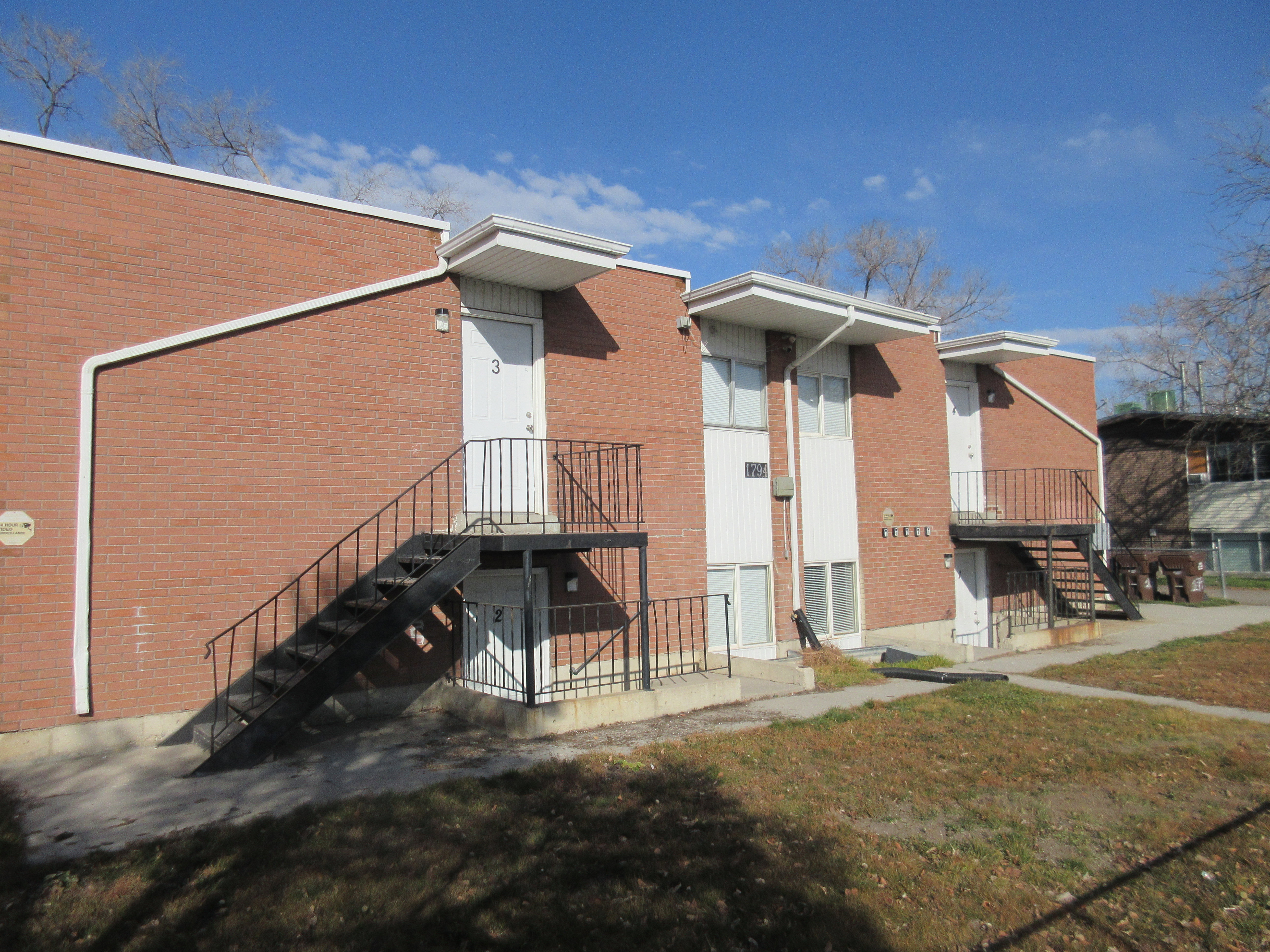View of apartment building / complex featuring stairs