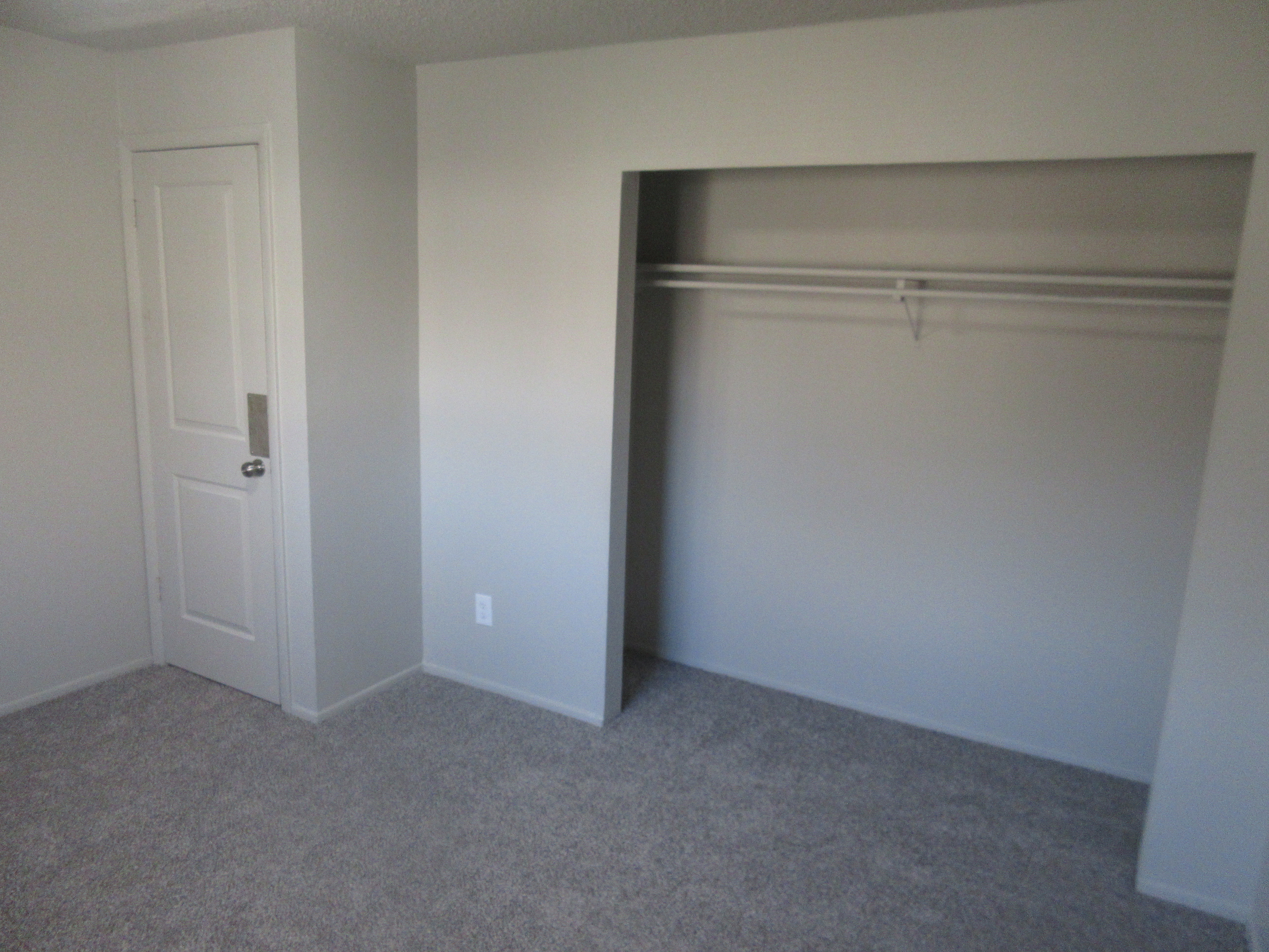 Unfurnished bedroom featuring carpet floors and a closet