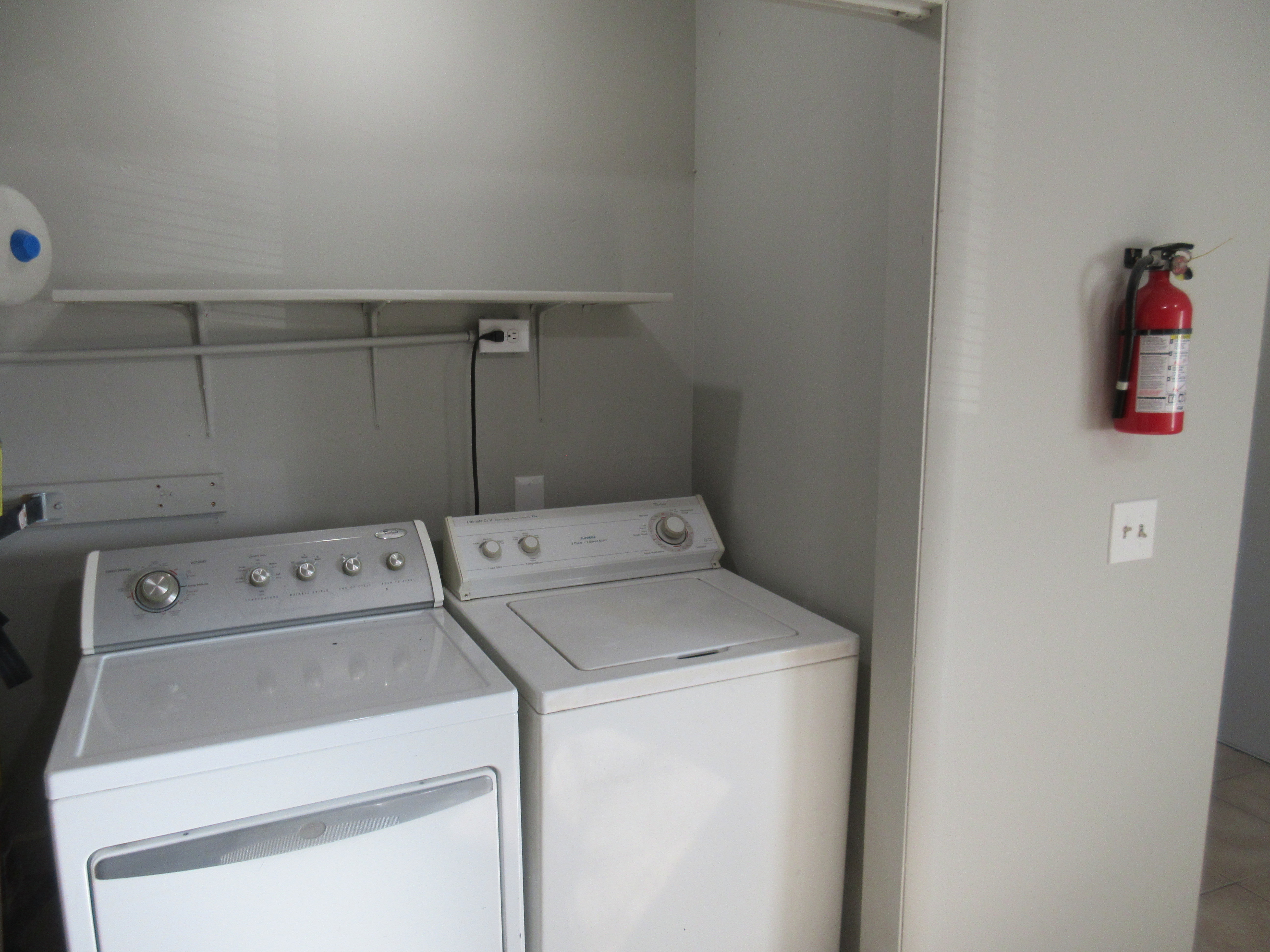 Laundry area featuring washing machine and clothes dryer