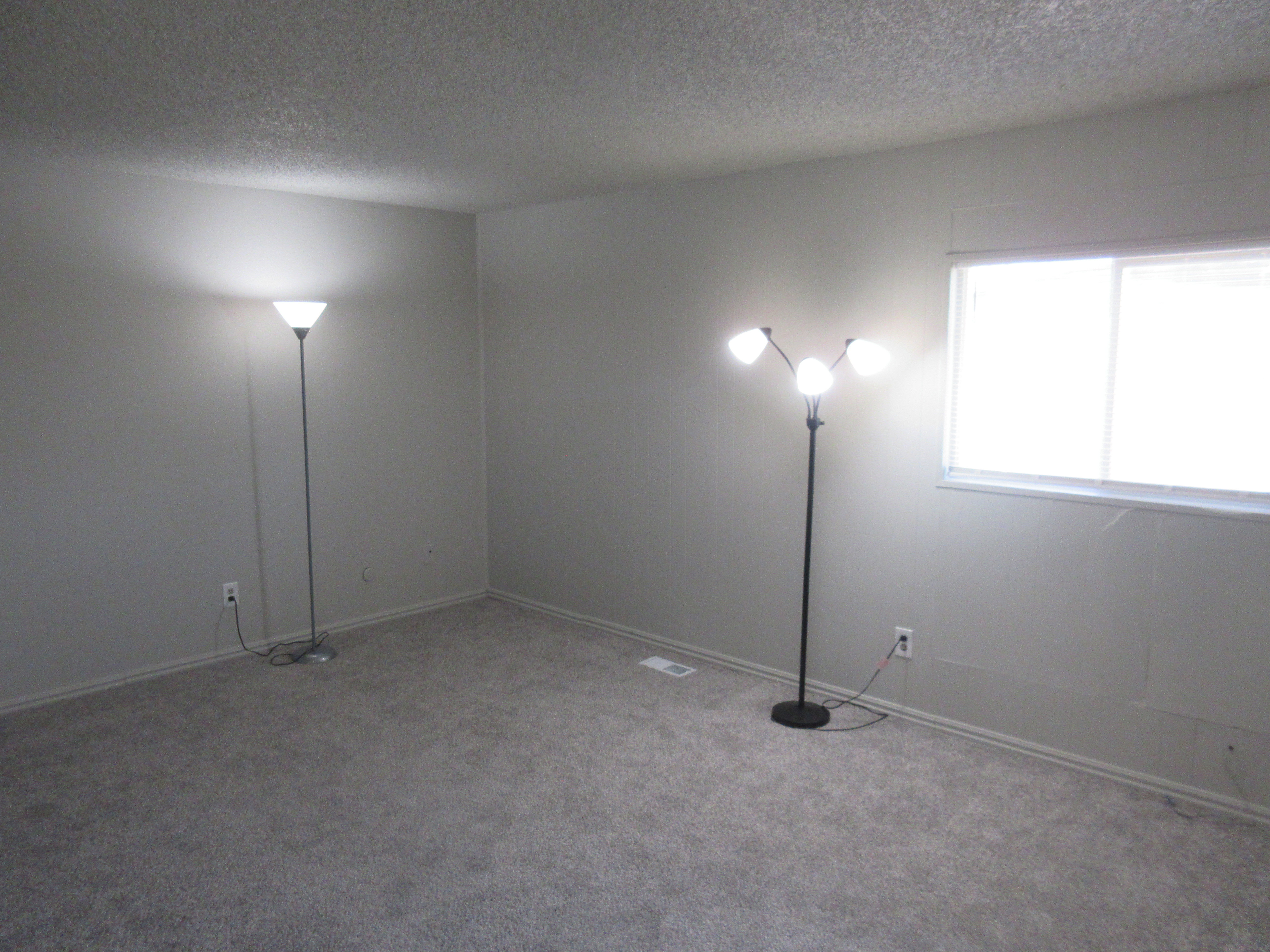 Spare room with a textured ceiling and carpet