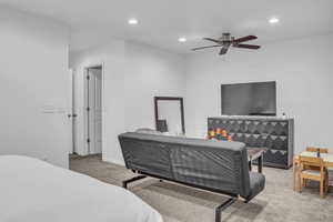 Bedroom featuring light carpet, recessed lighting, and ceiling fan