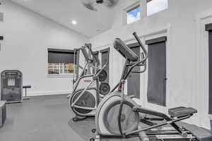 Workout room featuring vaulted ceiling