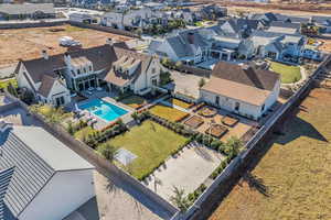 Aerial view of residential area featuring a pool