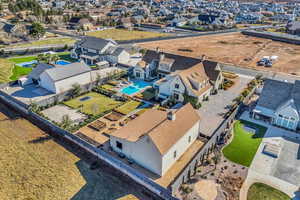 Aerial perspective of suburban area featuring a pool