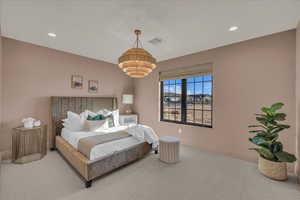 Carpeted bedroom featuring recessed lighting and baseboards