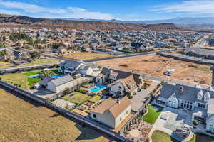 Aerial perspective of suburban area featuring a mountain backdrop