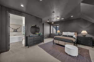 Carpeted bedroom featuring recessed lighting, multiple windows, and connected bathroom
