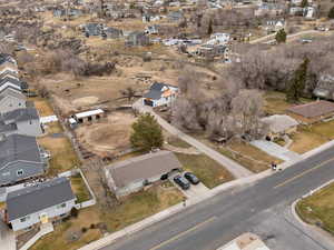 Aerial view of property's location featuring nearby suburban area