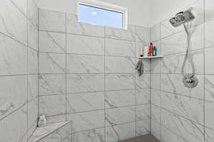 Bathroom with a tile shower