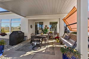 View of patio / terrace featuring outdoor dining area and a grill