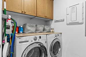 Laundry room with cabinet space and independent washer and dryer