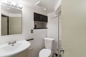 Bathroom featuring toilet and vanity