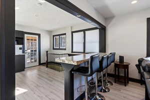 Dining room featuring light wood-style floors and recessed lighting
