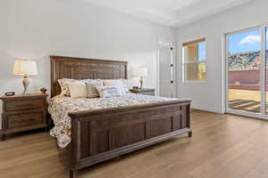 Bedroom featuring access to outside and light wood finished floors