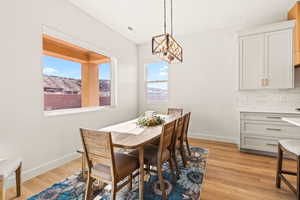 Dining room with baseboards and light wood-style floors