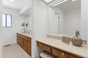 Hallway Full Bathroom featuring dual vanity and recessed lighting