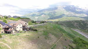 View of mountain backdrop featuring nearby suburban area