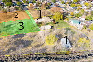 Aerial perspective of suburban area featuring property parcel outlined