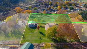 Aerial view of residential area featuring property parcel outlined
