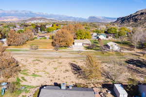Aerial perspective of suburban area with a mountain backdrop