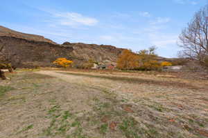 View of mountain background featuring rural landscape