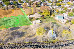 Aerial view of residential area featuring property boundaries highlighted