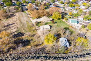 Aerial view of property's location featuring nearby suburban area