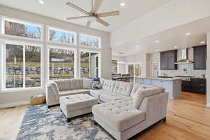 Living area featuring recessed lighting, ceiling fan, light wood finished floors, and healthy amount of natural light