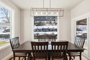 Dining room featuring wood finished floors and baseboards