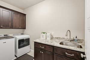 Laundry area featuring cabinet space and washer and dryer