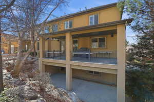 Back of house with stucco siding