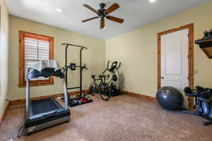 Exercise room with carpet flooring, ceiling fan, and recessed lighting