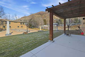 View of patio featuring a pergola and a mountain view