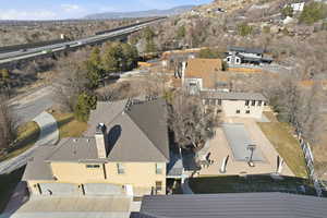View of property location with a mountain backdrop and nearby suburban area