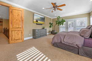 Bedroom with access to outside, carpet floors, crown molding, a ceiling fan, and recessed lighting