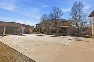 Back of property featuring stucco siding