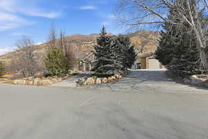 View of asphalt road featuring a mountain view