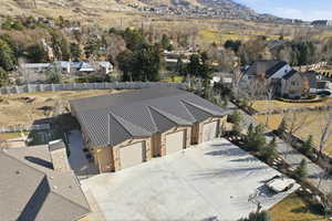 Aerial perspective of suburban area featuring a mountain backdrop
