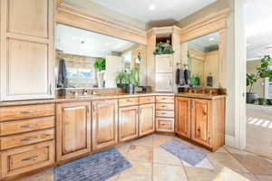 Full bathroom featuring vanity, stone tile flooring, and recessed lighting