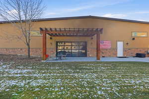 View of outbuilding with a pergola
