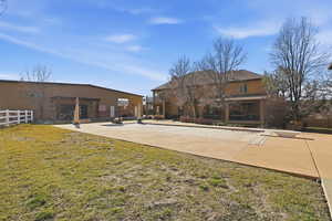 Rear view of house with stucco siding