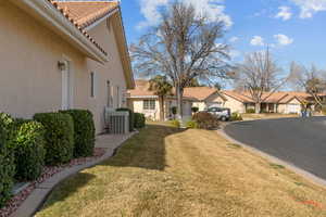 View of grassy yard with a residential view