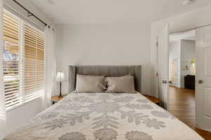Bedroom with wood finished floors