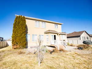 View of front of house featuring a patio and stucco siding