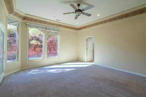 Carpeted spare room featuring a ceiling fan, recessed lighting, and crown molding