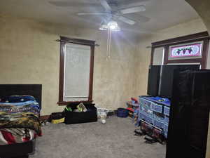 Bedroom with carpet floors and a ceiling fan