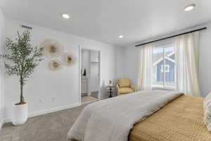 Bedroom featuring carpet, recessed lighting, and a spacious closet