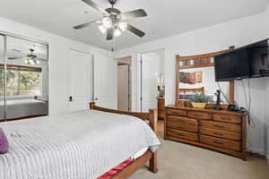 Bedroom featuring light colored carpet and ceiling fan