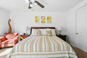 Bedroom featuring carpet floors and a ceiling fan