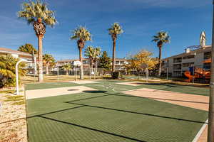 Surrounding community featuring community basketball court and a residential view